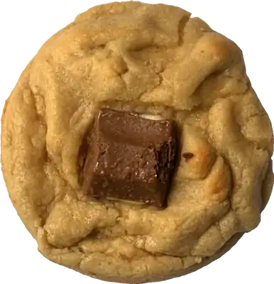 Golden cookie topped with a piece of Kinder chocolate